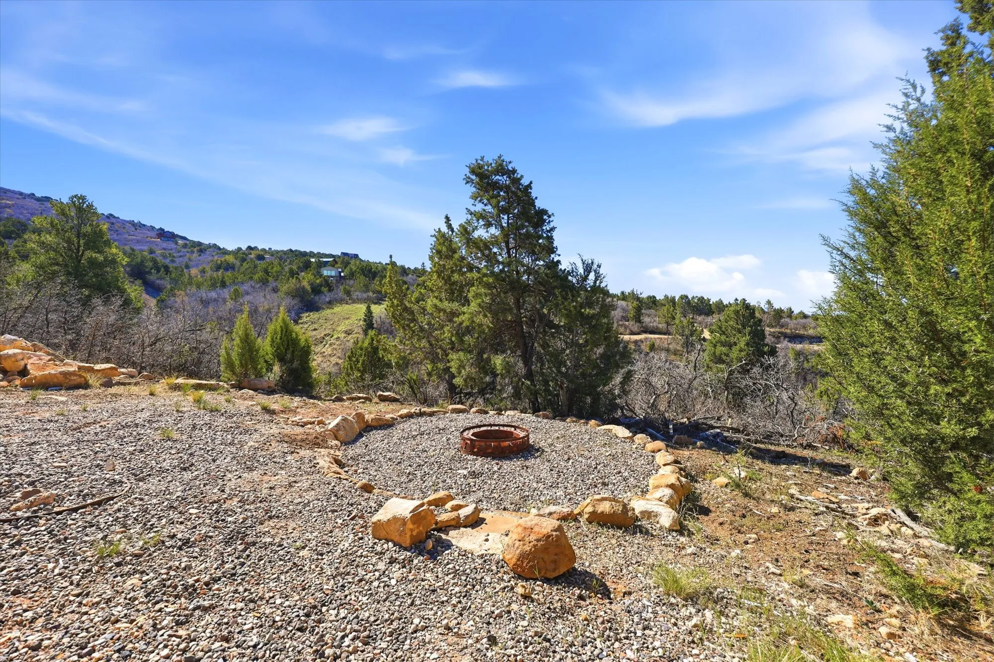 View of yard with an outdoor fire pit