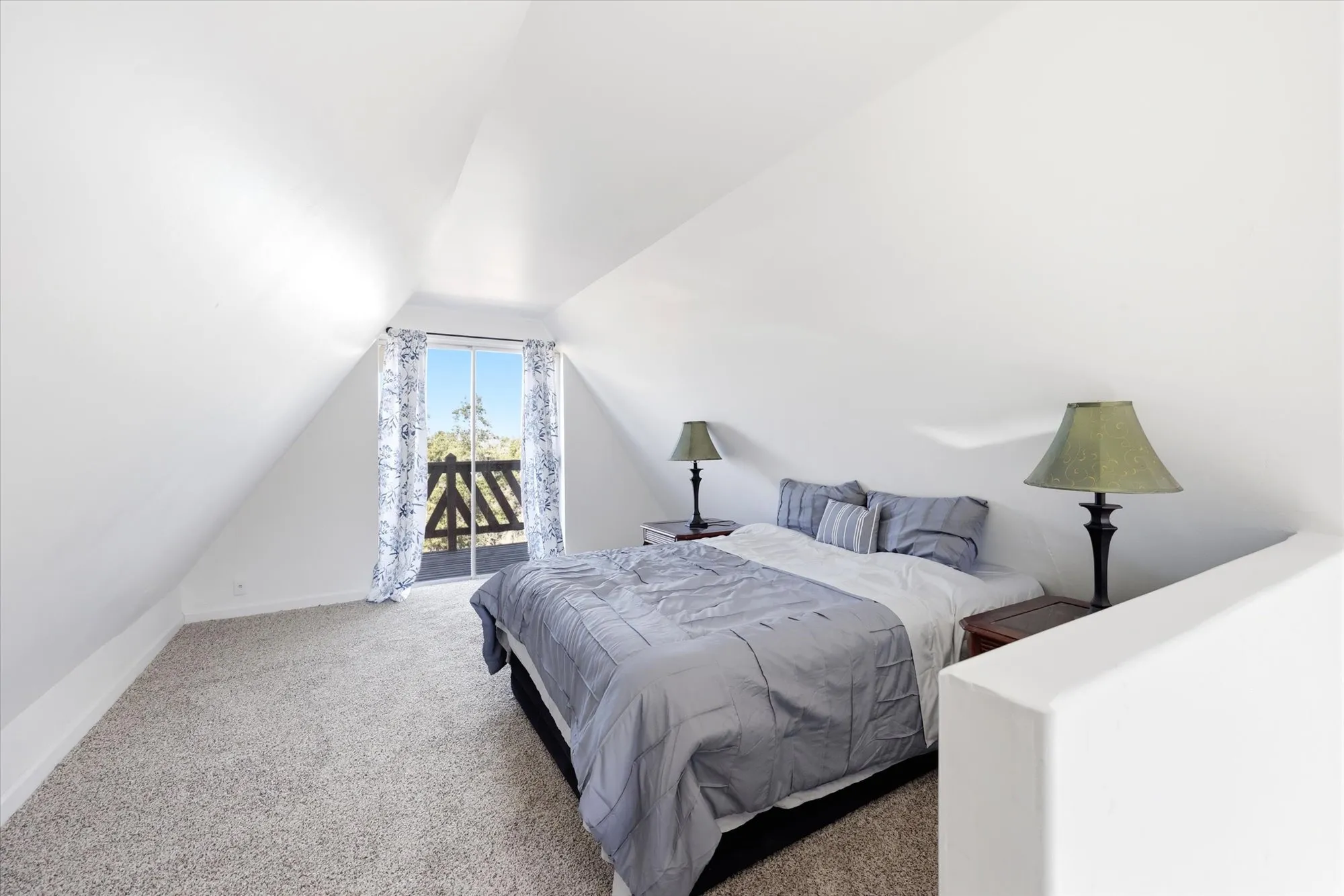 Bedroom featuring carpet floors and baseboards
