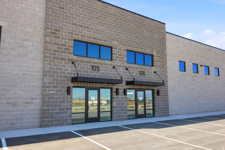 Modern commercial building featuring a gray brick exterior