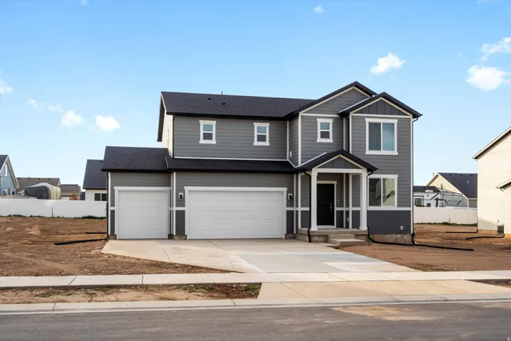 **DISCLAIMER** Exterior elevation and color may vary.  Contemporary residence featuring gray siding and white trim
