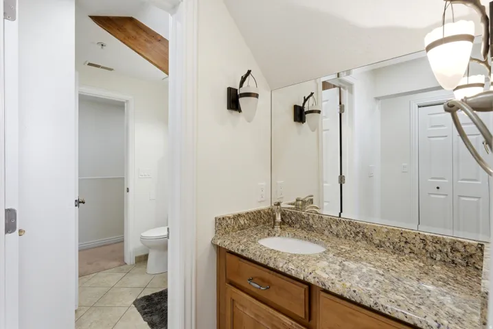 Bathroom with vanity and light tile patterned floors