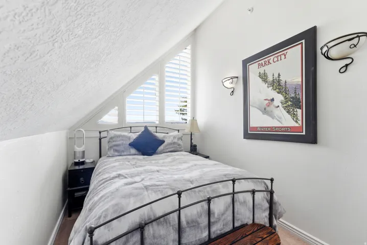 Carpeted bedroom featuring baseboards
