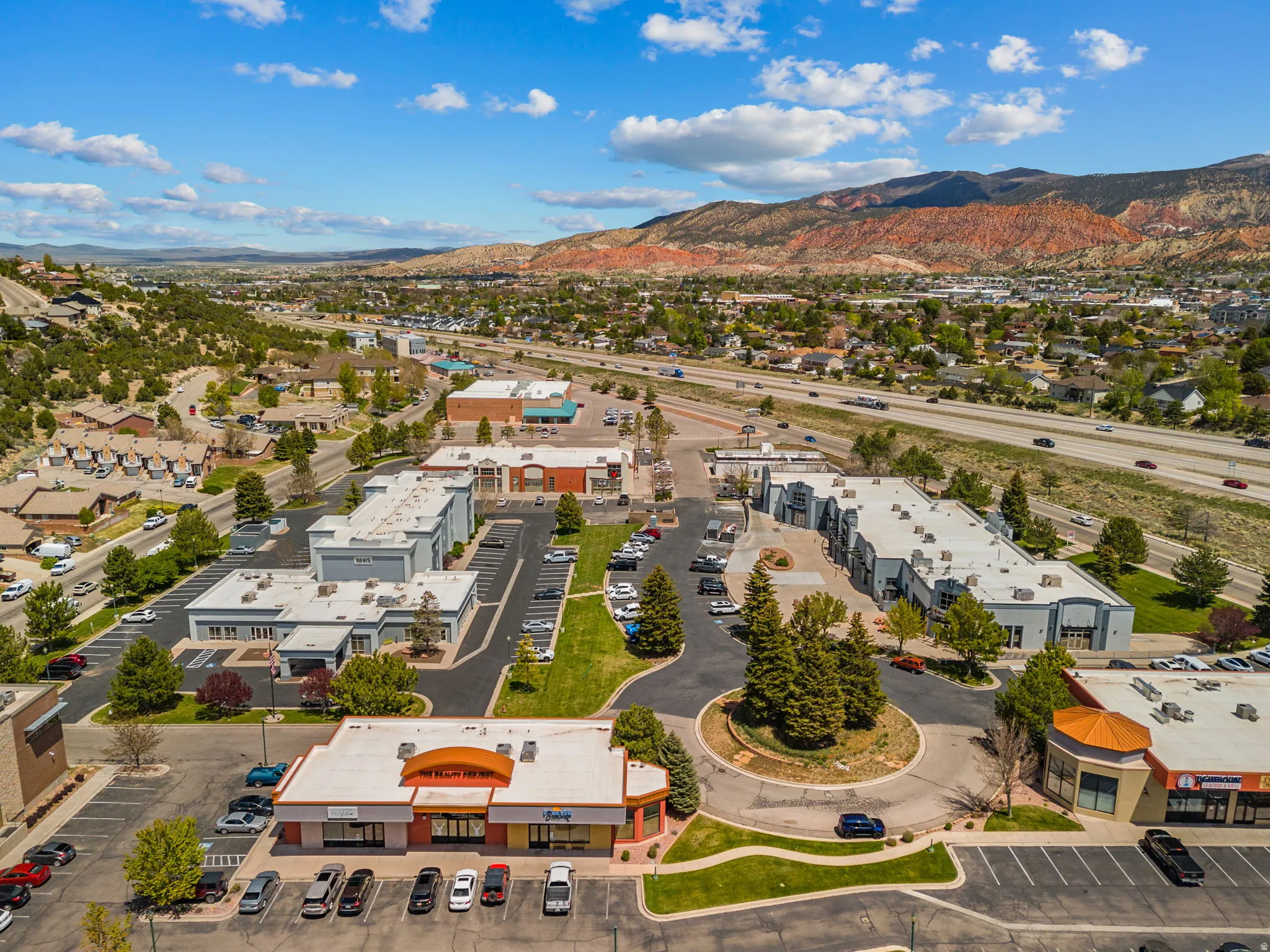 Aerial perspective showcasing commercial properties with ample parking