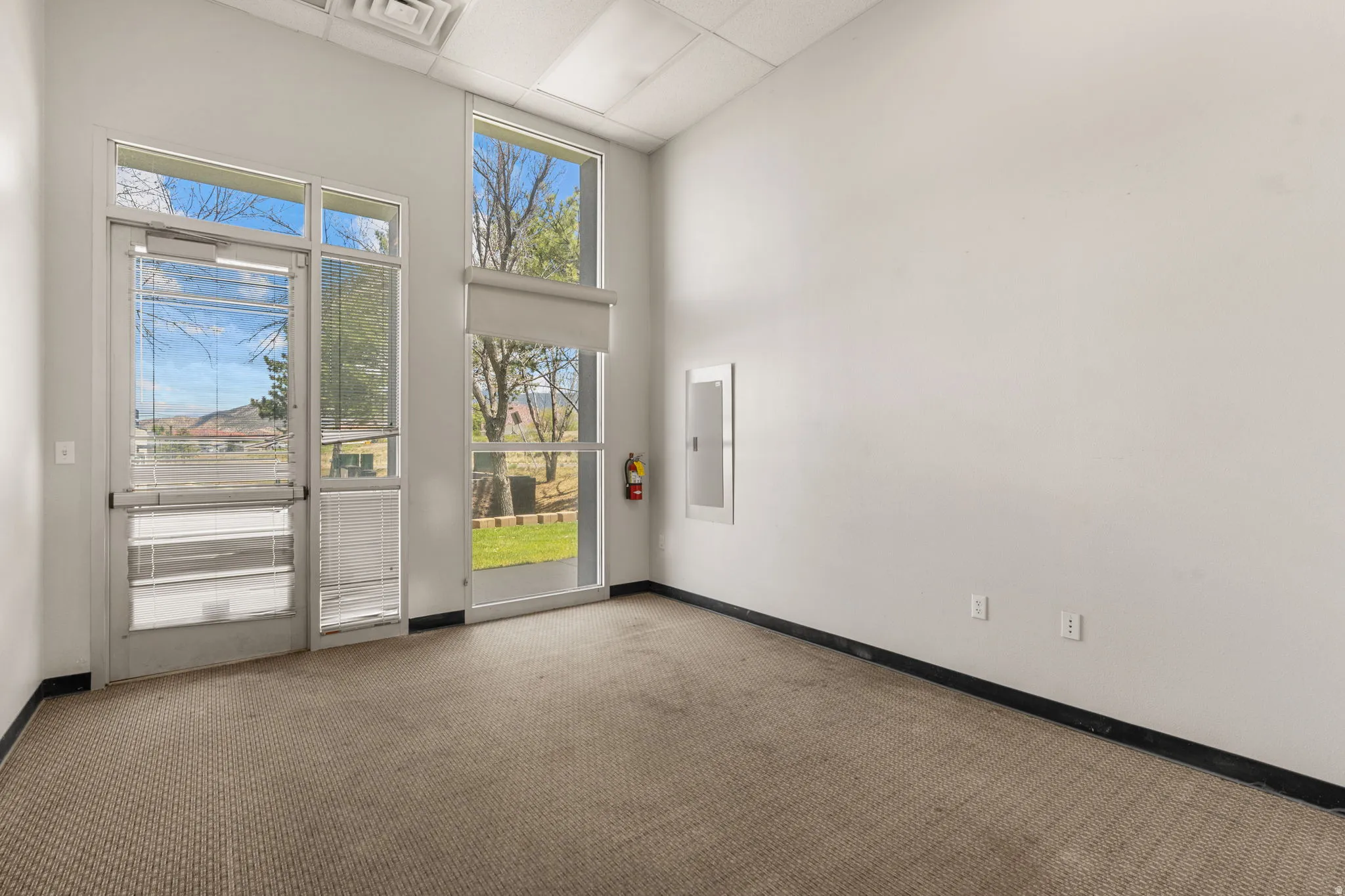 Expansive window wall with a glass panel entry door