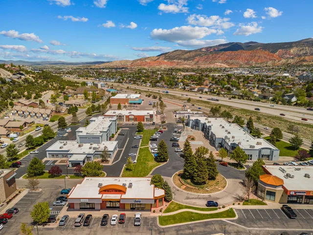 Aerial perspective showcasing commercial properties with ample parking