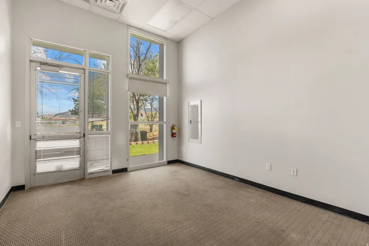 Expansive window wall with a glass panel entry door