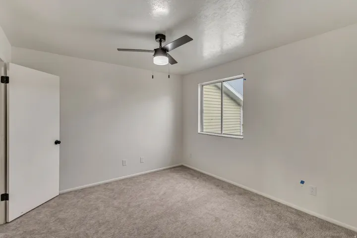 Neutral wall finishes with a ceiling fan light fixture