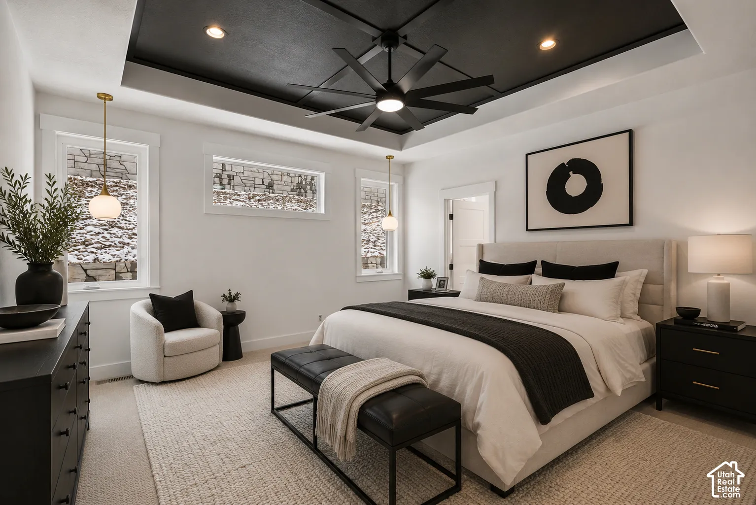Recessed tray ceiling with dark paint finish and ceiling fan