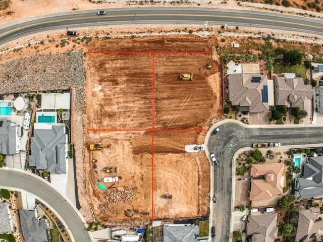 Aerial Survey. Depicting a land parcel with boundary lines demarcated, adjacent to developed structures and a roadway