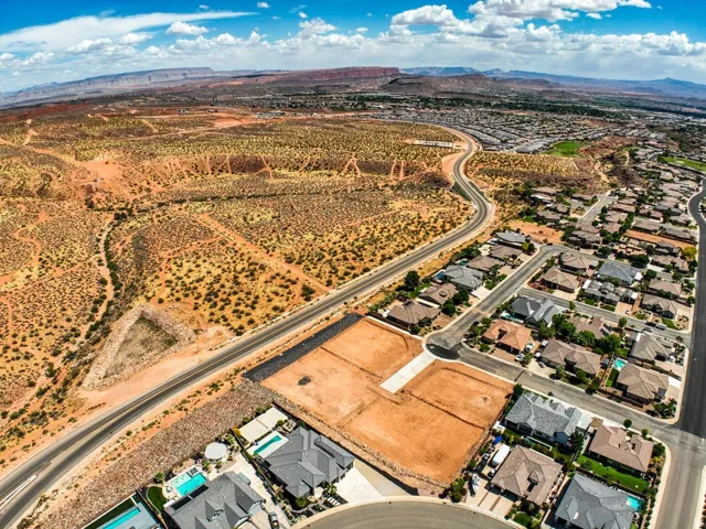 Expansive aerial capturing a desert landscape with existing residential developments