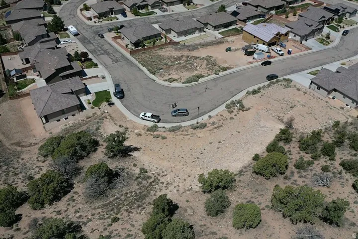 Expansive undeveloped land parcel featuring natural terrain and varied plant life