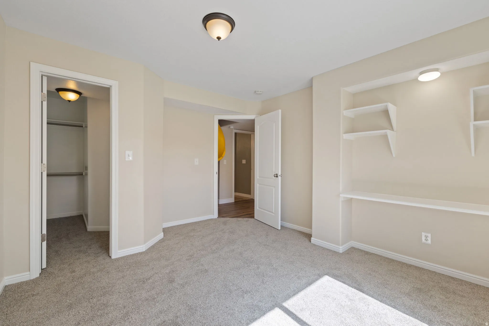 Bedroom 5 with built in shelves and large closet
