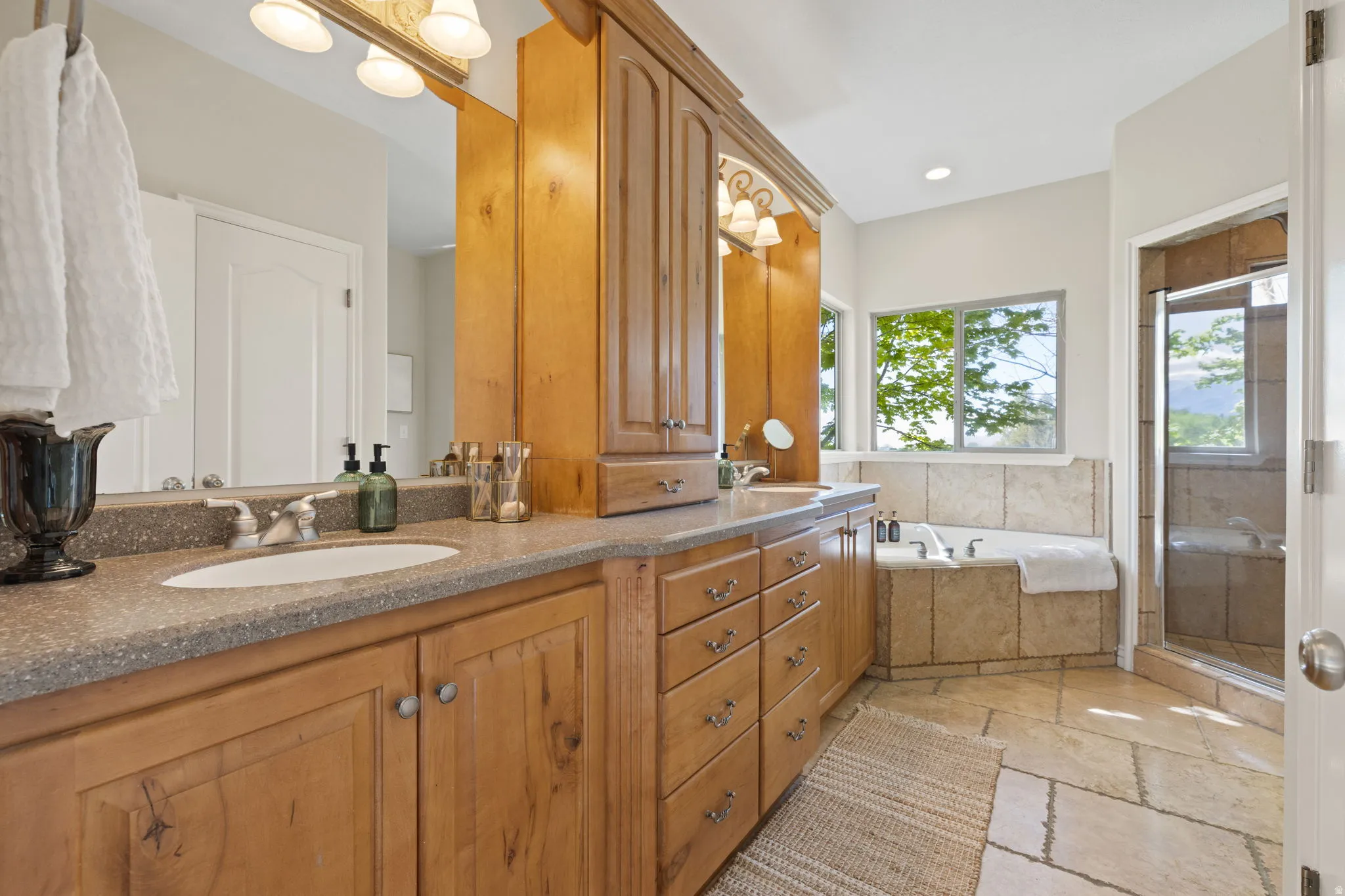 Primary bath with jetted spa tub and separate shower.