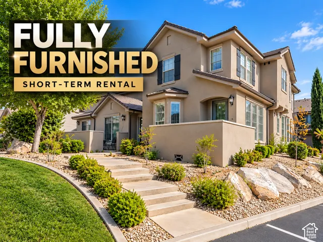 Multi-story stucco exterior with decorative shutters, integrated outdoor lighting, and a tiered concrete walkway