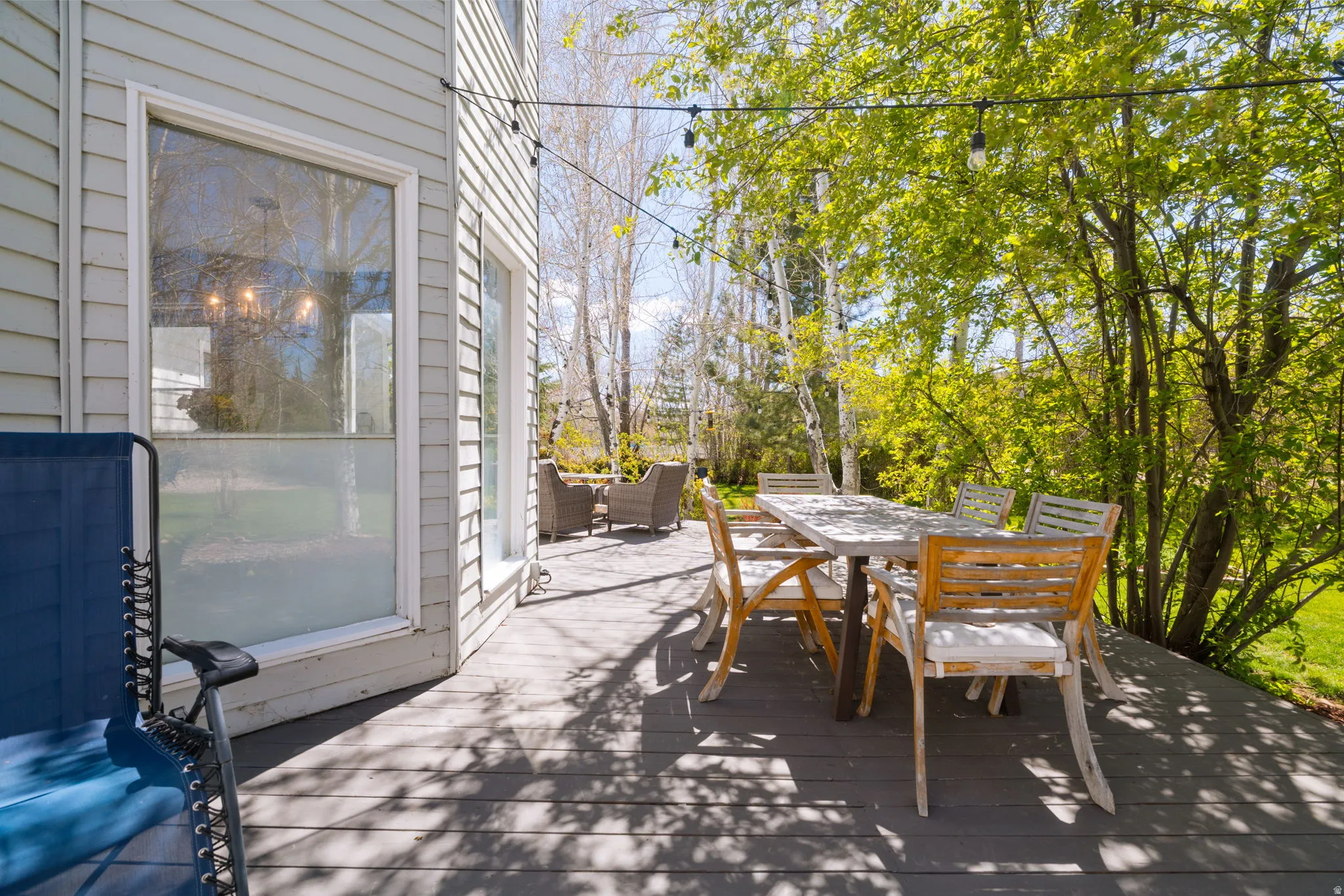 Spacious exterior deck with grey wood-finish decking