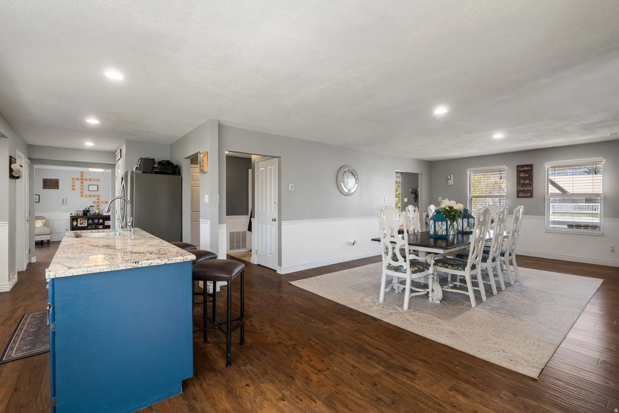 Open concept living space featuring wood-finish flooring throughout