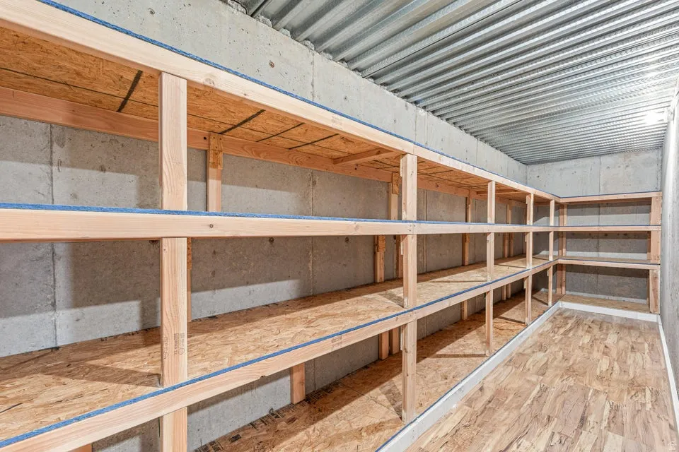 Extensive built-in wood shelving units provide ample storage capacity