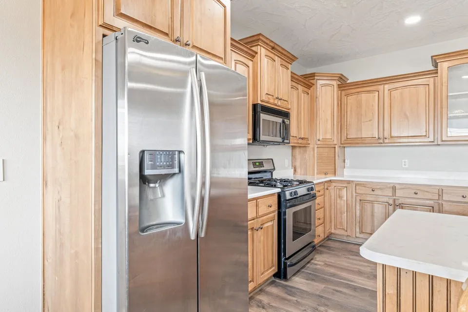 Stainless steel French door refrigerator with an in-door water and ice dispenser
