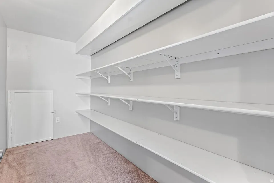 White painted shelving system with four tiers