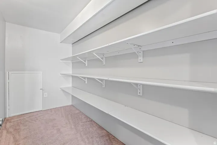 White painted shelving system with four tiers