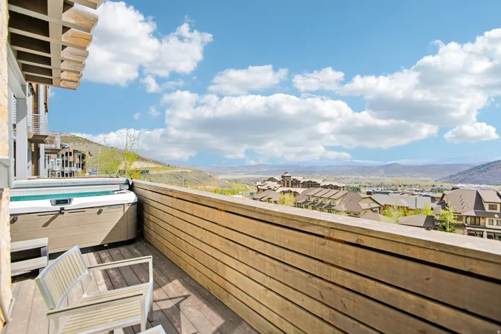Private outdoor deck featuring a built-in hot tub