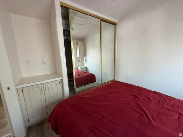 Mirrored sliding closet doors with gold-tone trim
