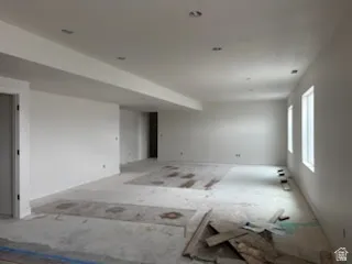 Multiple windows providing natural light, and a clean, neutral color palette.A big family room, entertaiment area in basement.