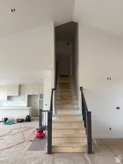 stairs going up , 2 bedrooms and a bath located above garage area.