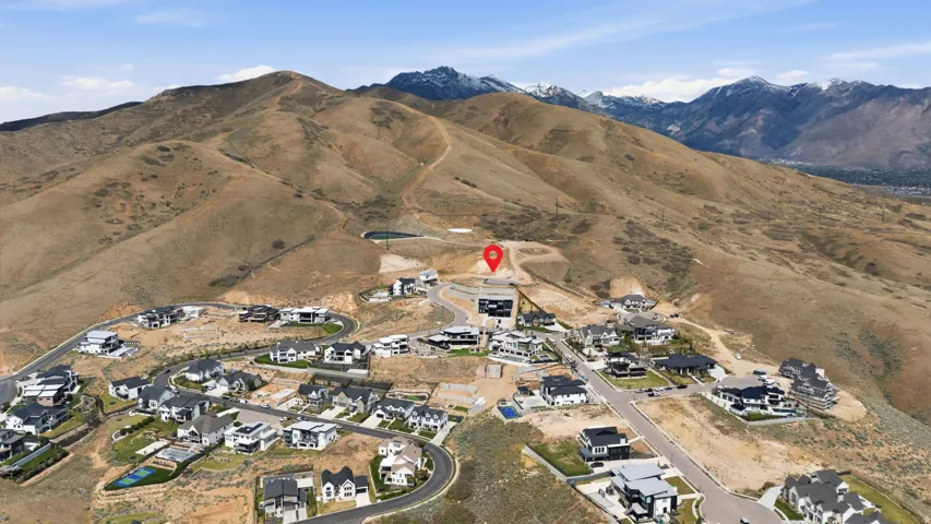 Mountainous terrain surrounding a developing hillside community