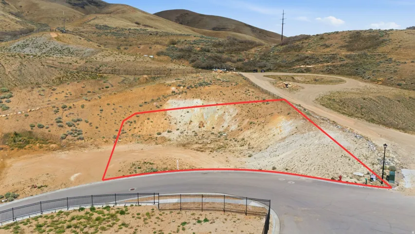 Cul-de-sac lot featuring graded terrain and a paved roadway