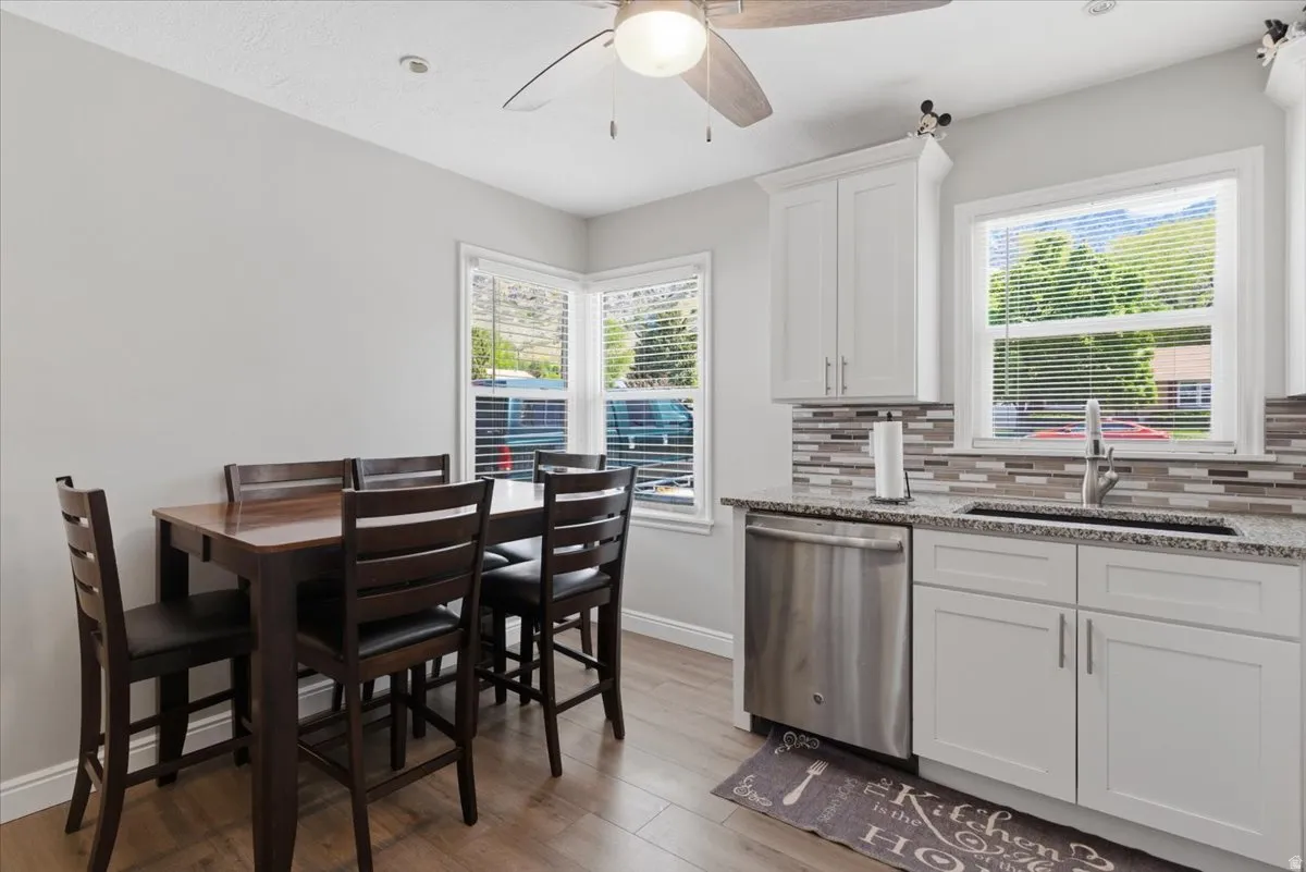 Kitchen and dining area featuring wood-finish flooring