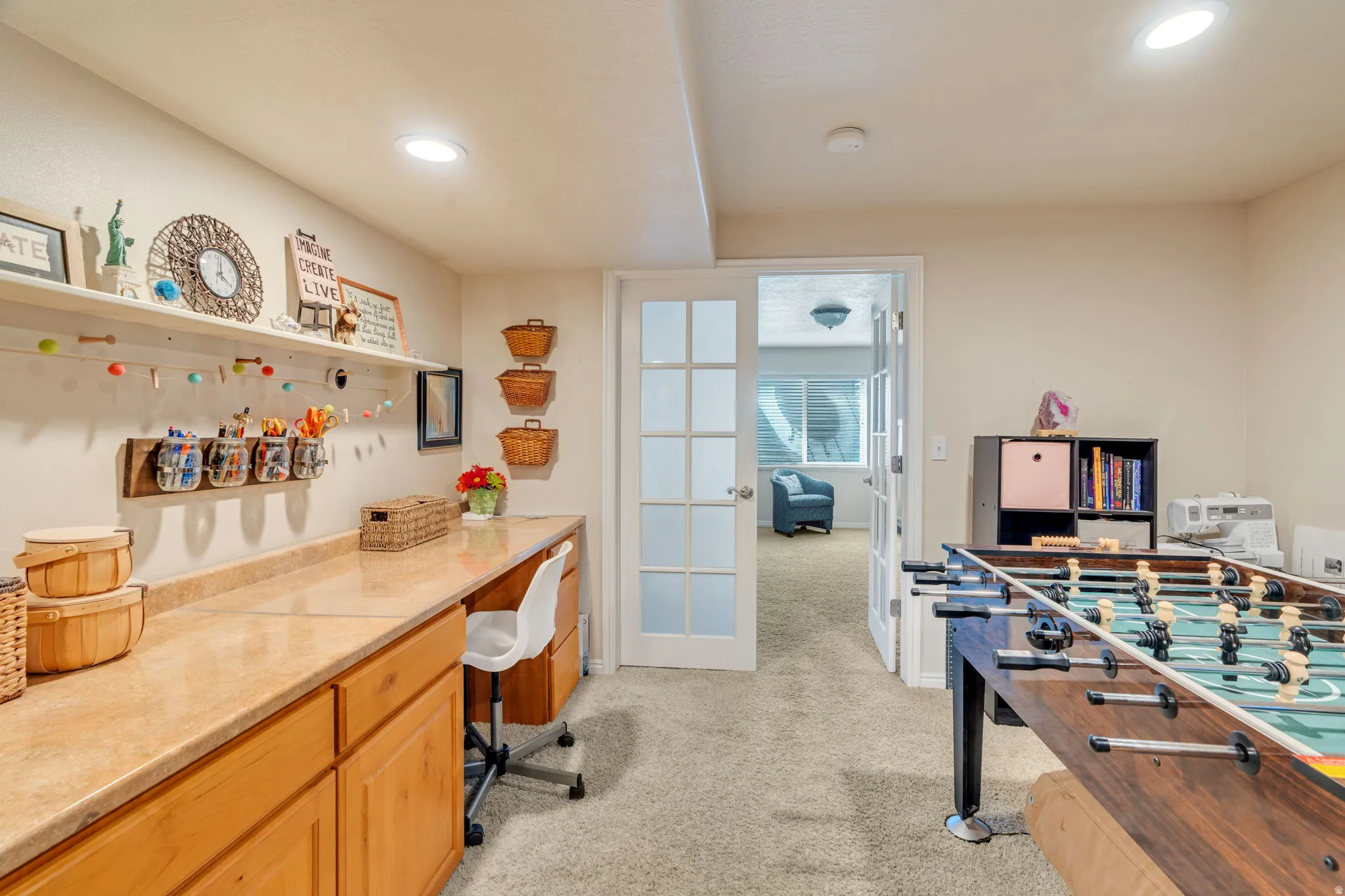 Rec room with light colored carpet and recessed lighting