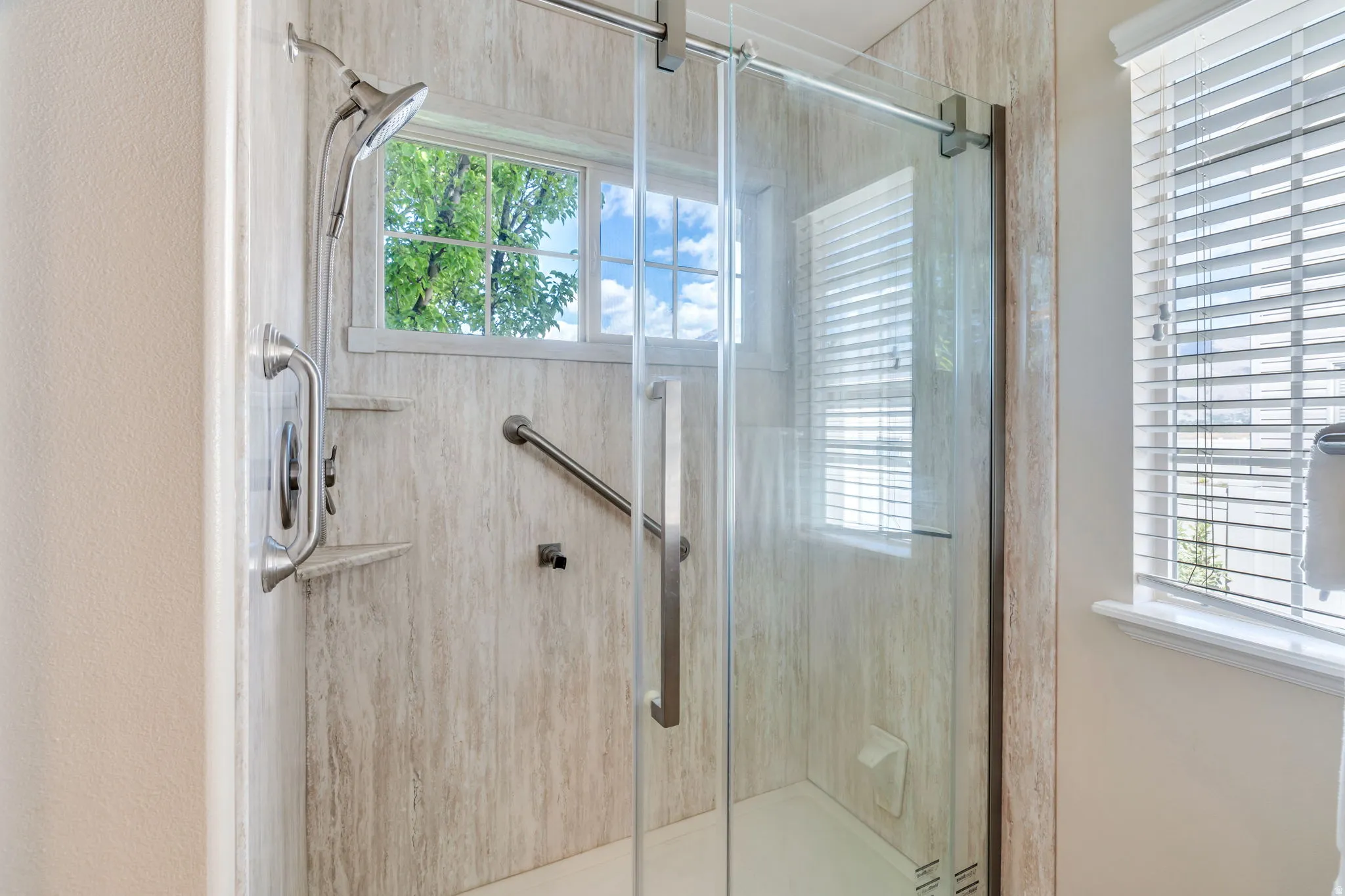 Bathroom featuring a shower stall
