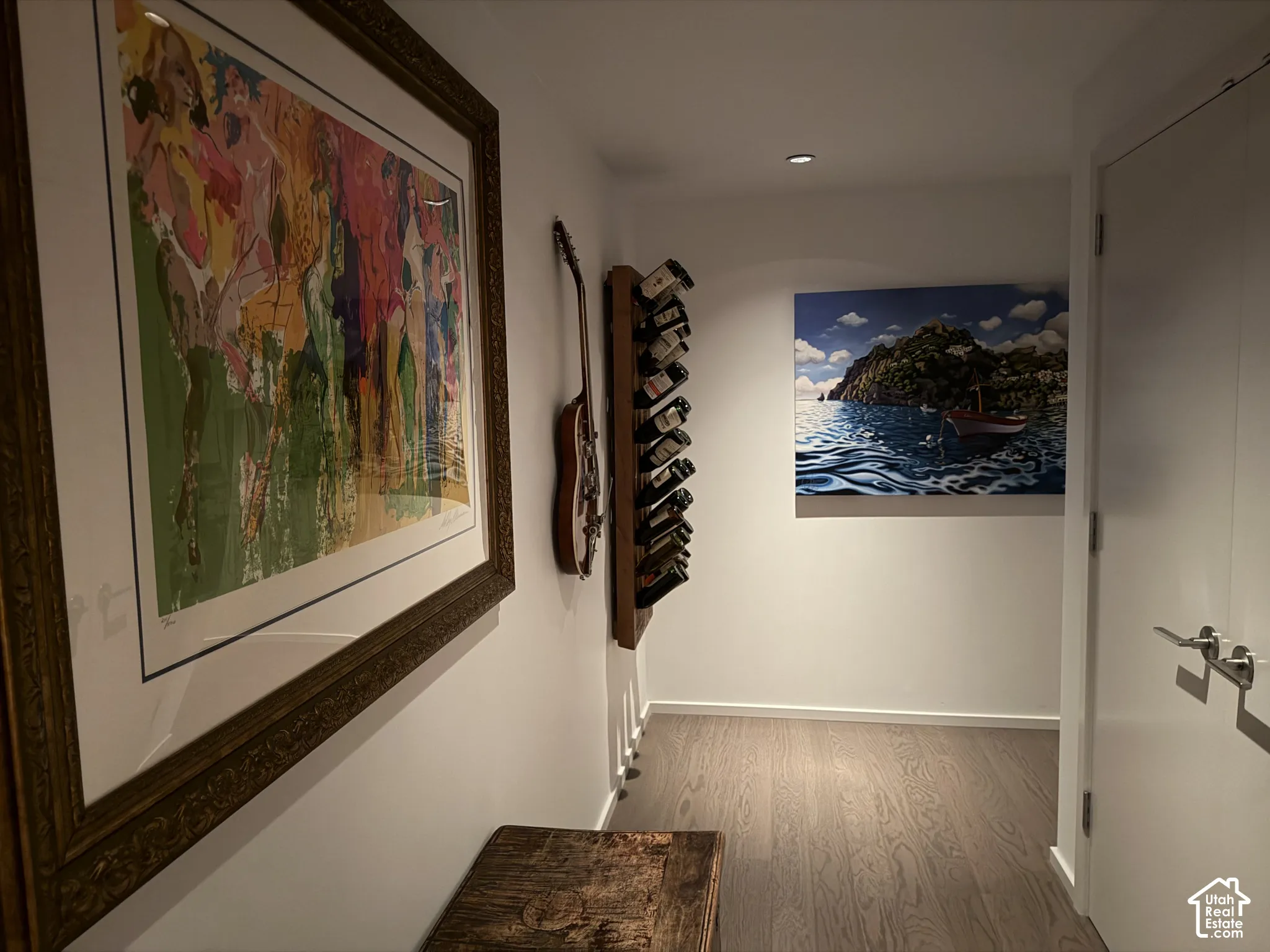 Hallway featuring wood-finish flooring and recessed lighting