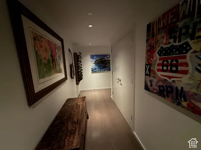 Recessed lighting illuminating wood-finish flooring