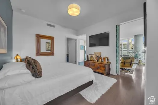 Bedroom with dark wood finished floors