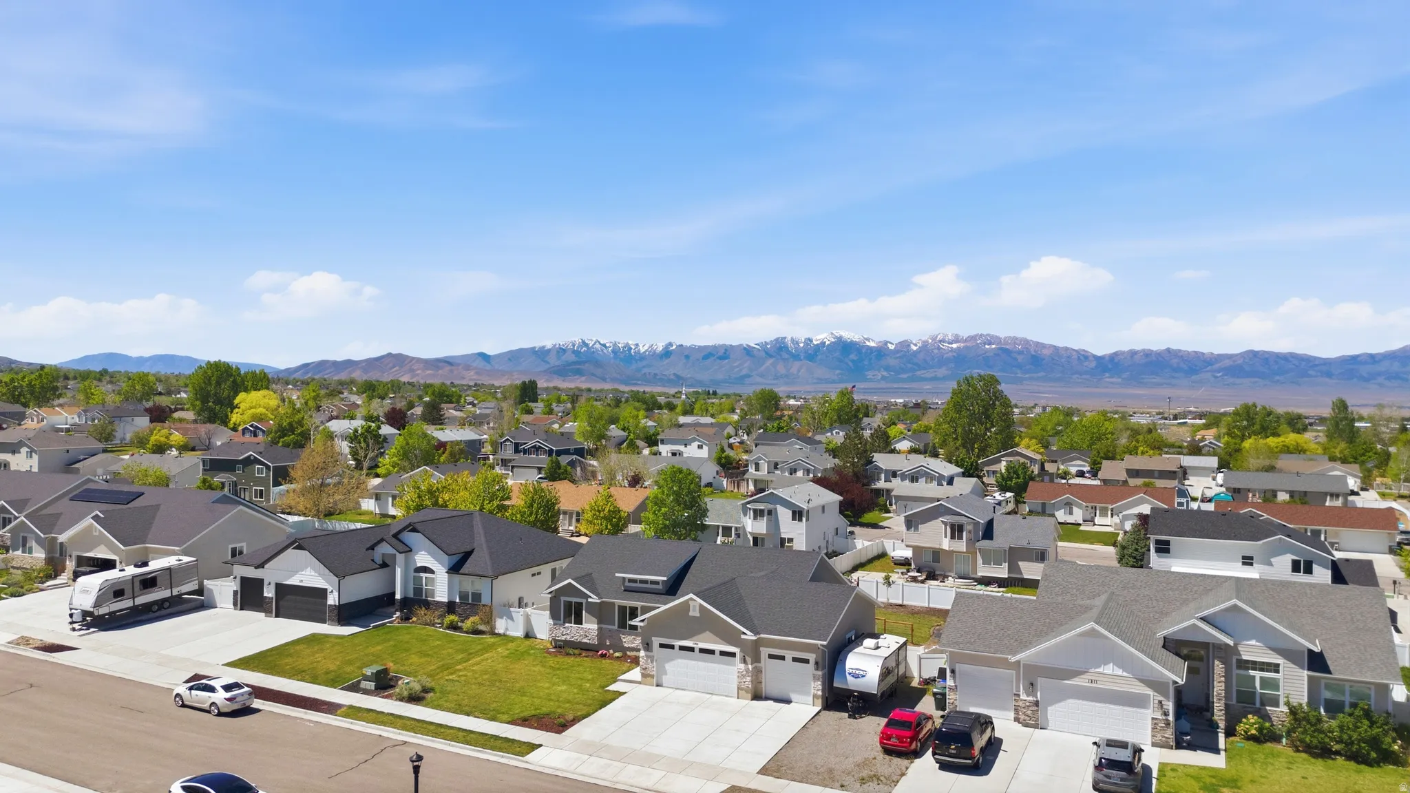 Residential neighborhood featuring diverse home styles and mountain backdrop