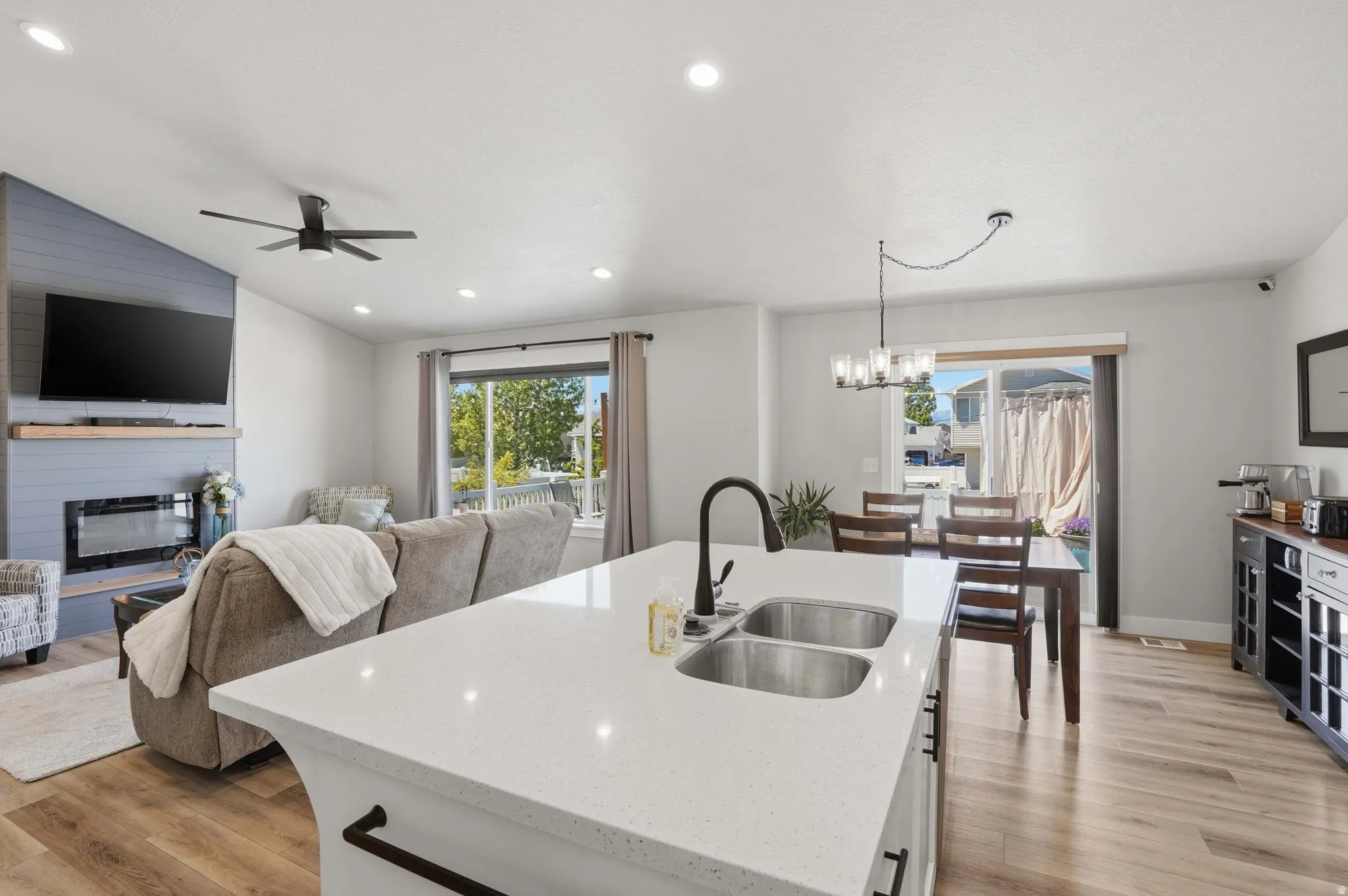 Kitchen island with white countertop and double basin sink