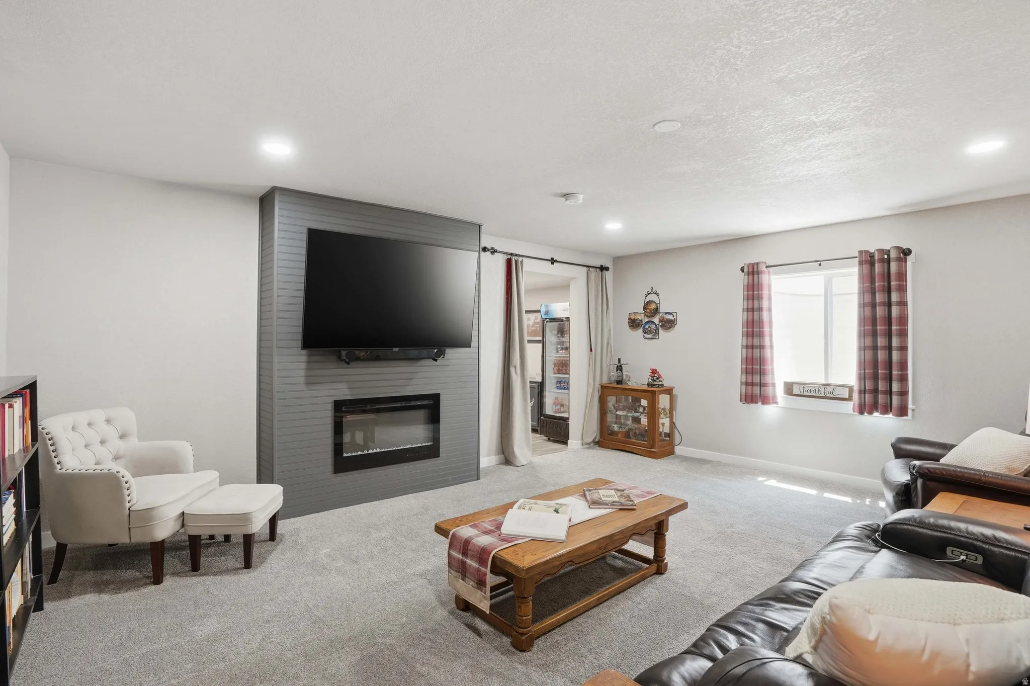 Huge Family Room featuring recessed lighting, light gray carpeting, and a built-in electric fireplace with a dark gray shiplap-style surround