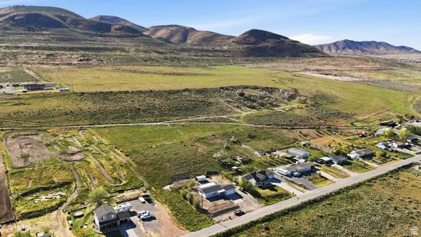 Expansive rural landscape featuring distant mountains