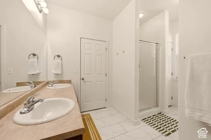 Dual vanity with undermount sinks and chrome fixtures
