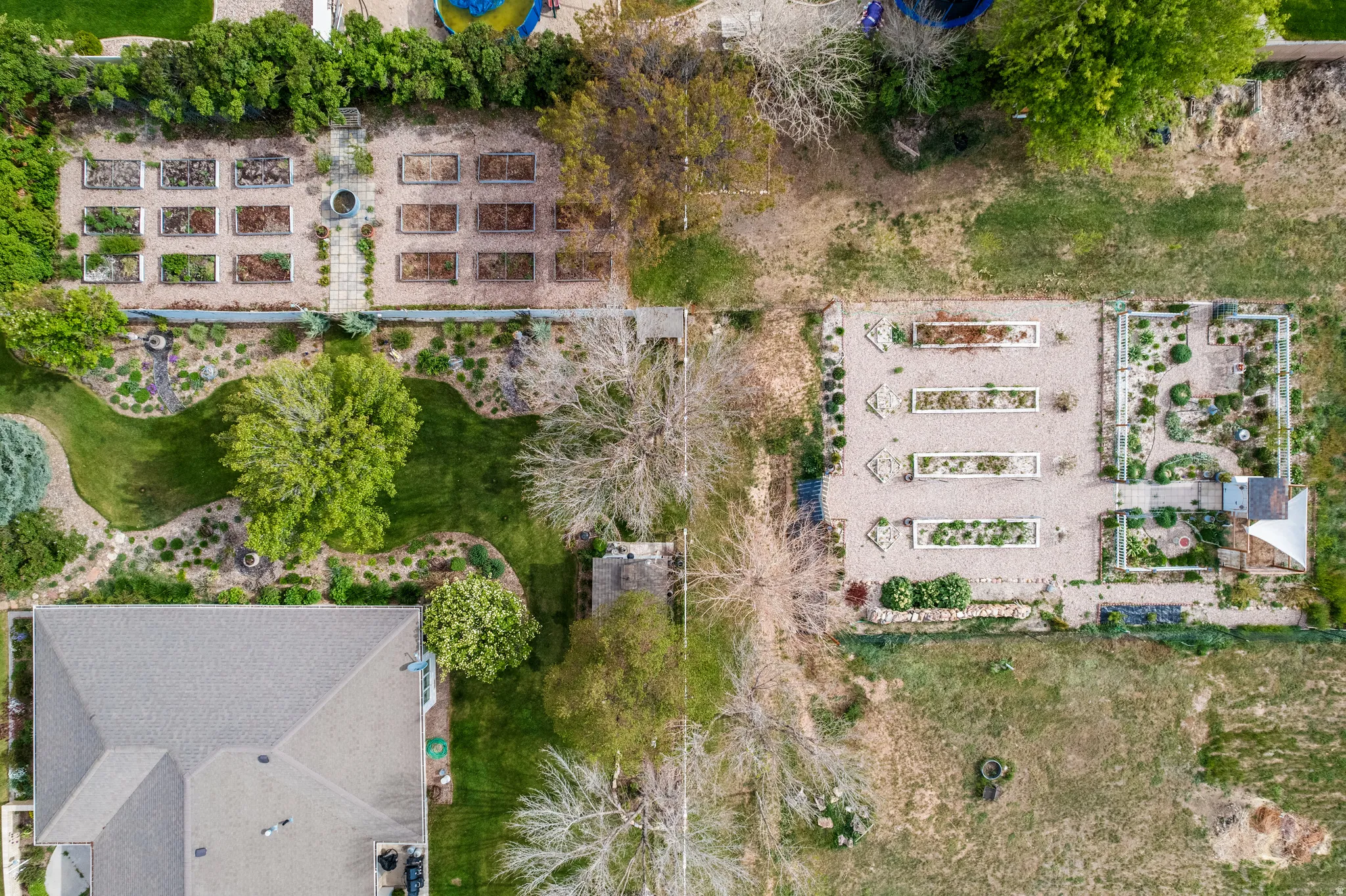 Expansive grounds featuring multiple landscaped garden areas and a manicured lawn