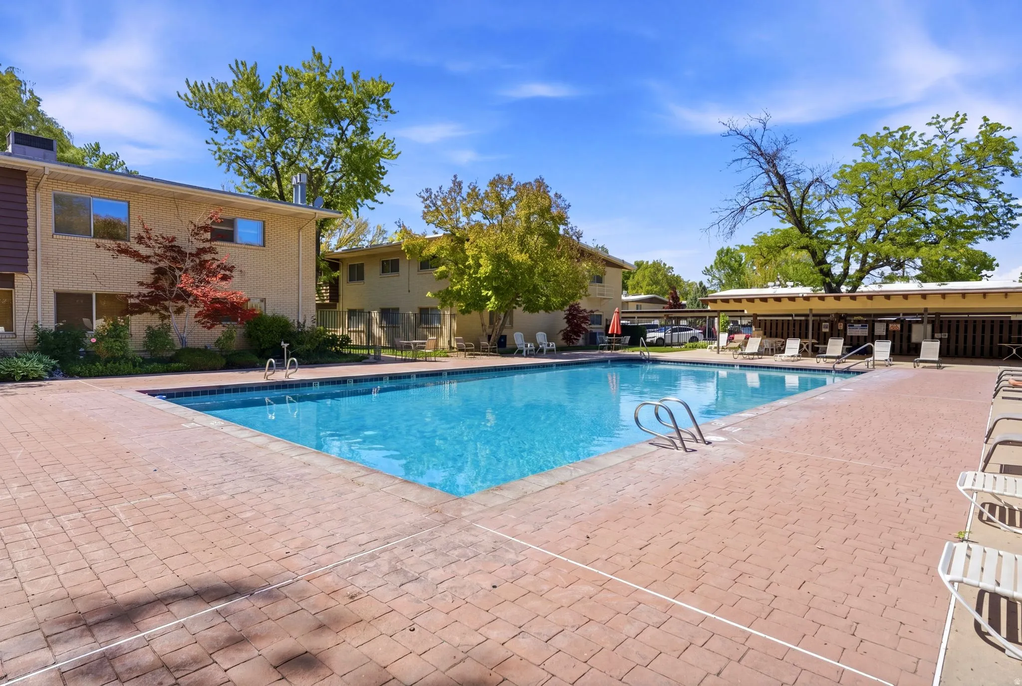 Outdoor swimming pool with brick paver surround