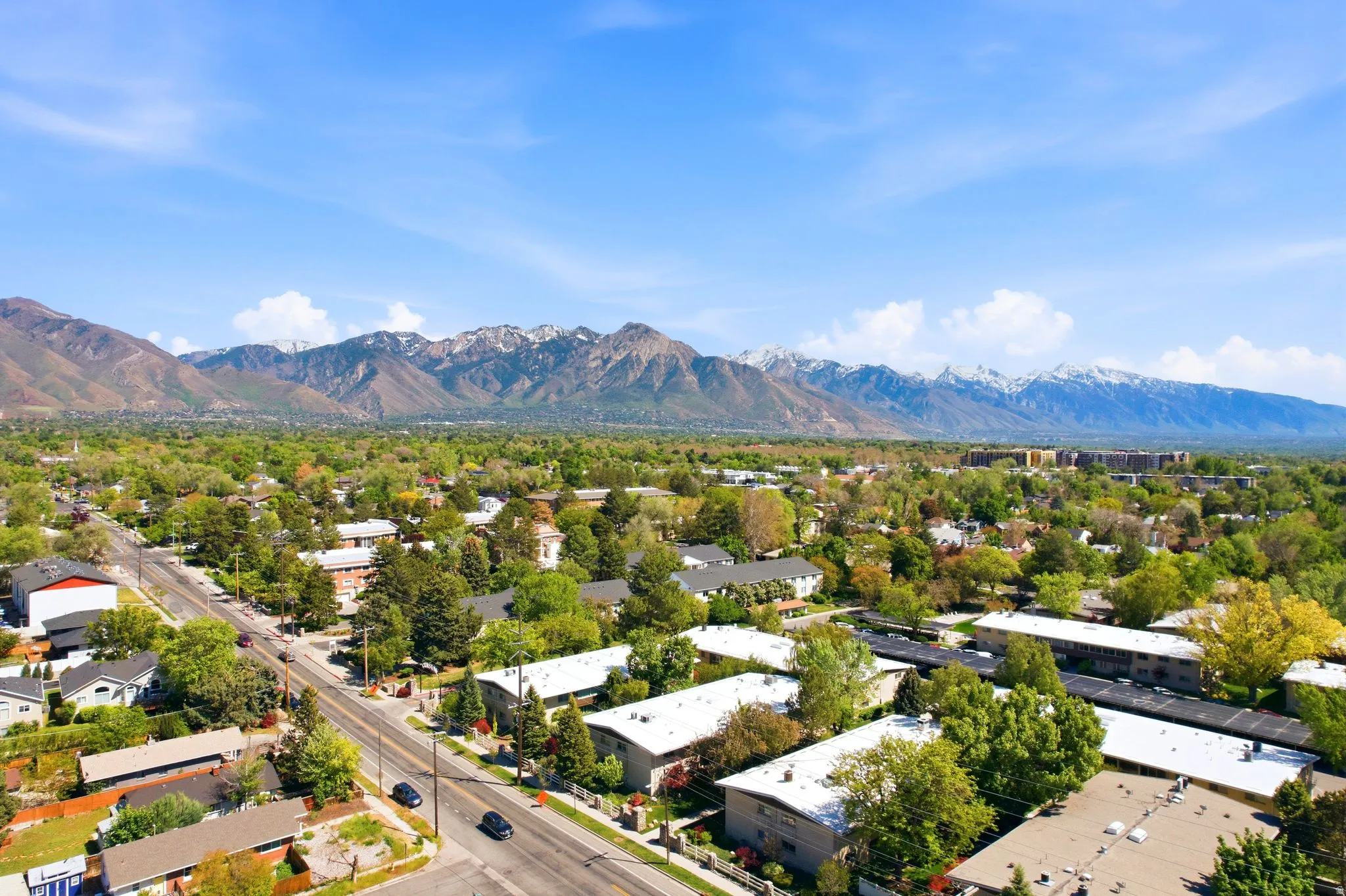 Expansive mountain backdrop with snow-capped peaks