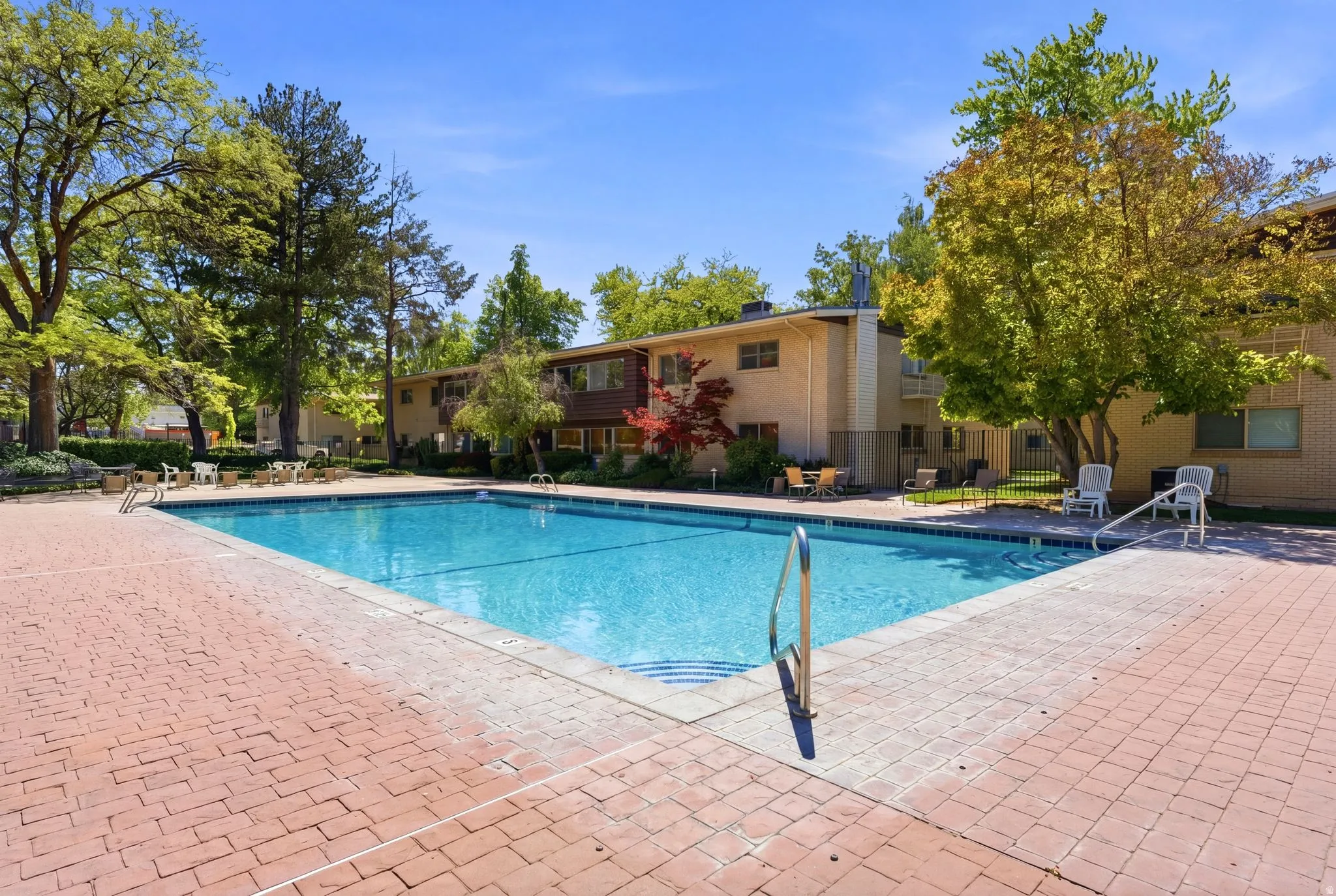 Outdoor swimming pool with brick paver surround