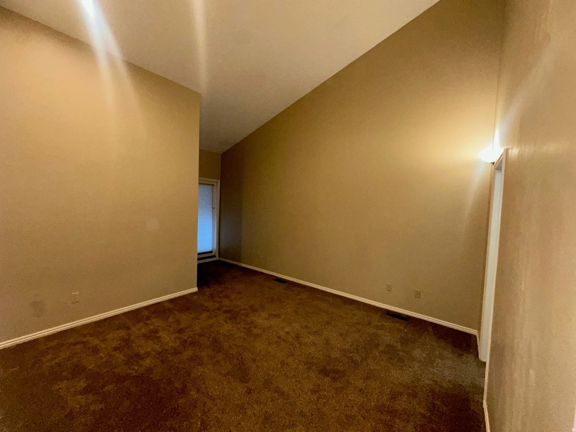 Spacious master on main level featuring vaulted ceilings