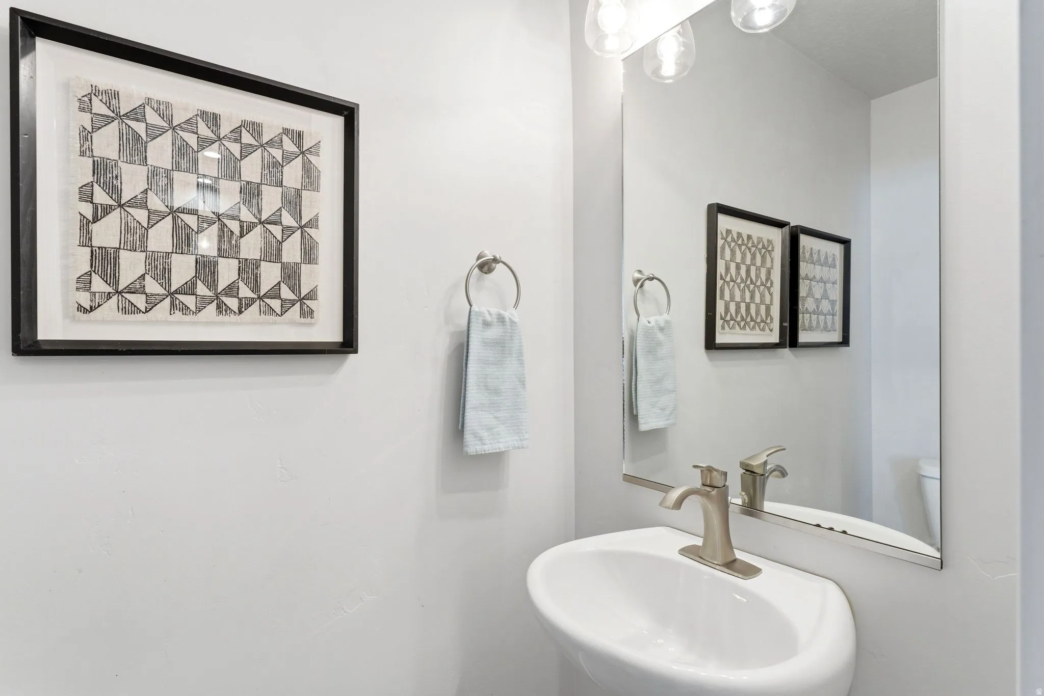 Powder room on the main level - guests do not need to see upstairs (in case you haven't put away that laundry that has been sitting in the basket for an embarrassing amount of time)
