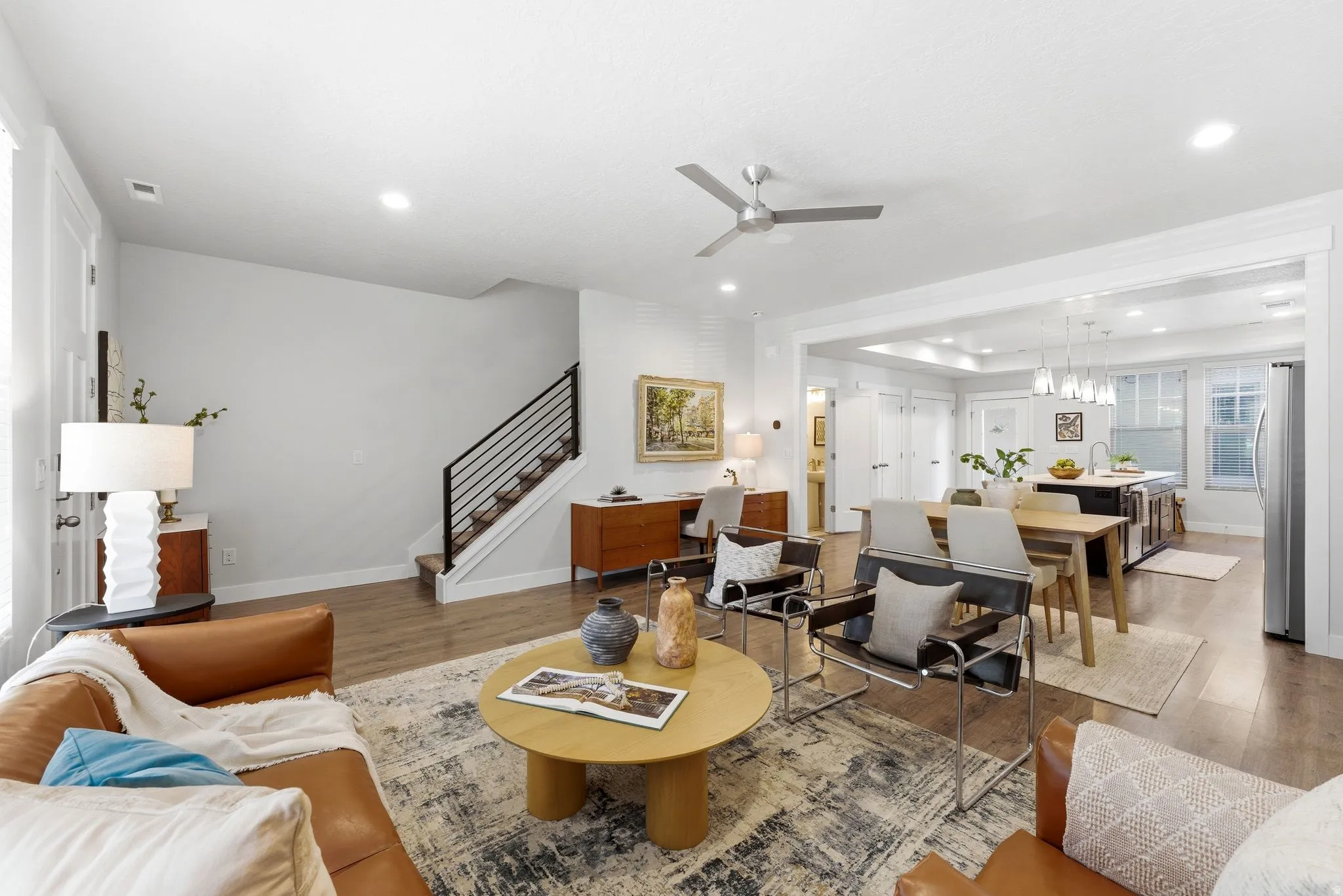 Open-concept living area with living room, dining and kitchen