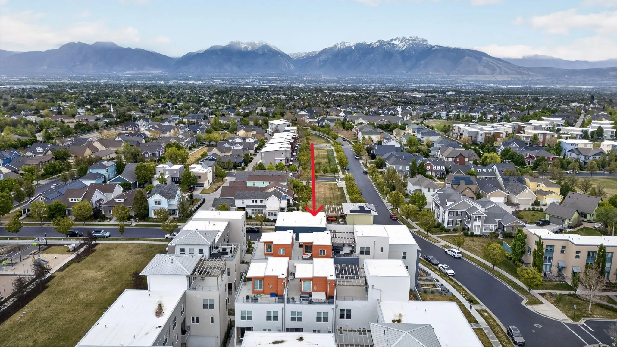 Modern multi-story residential architecture featuring flat roofs and varied exterior finishes