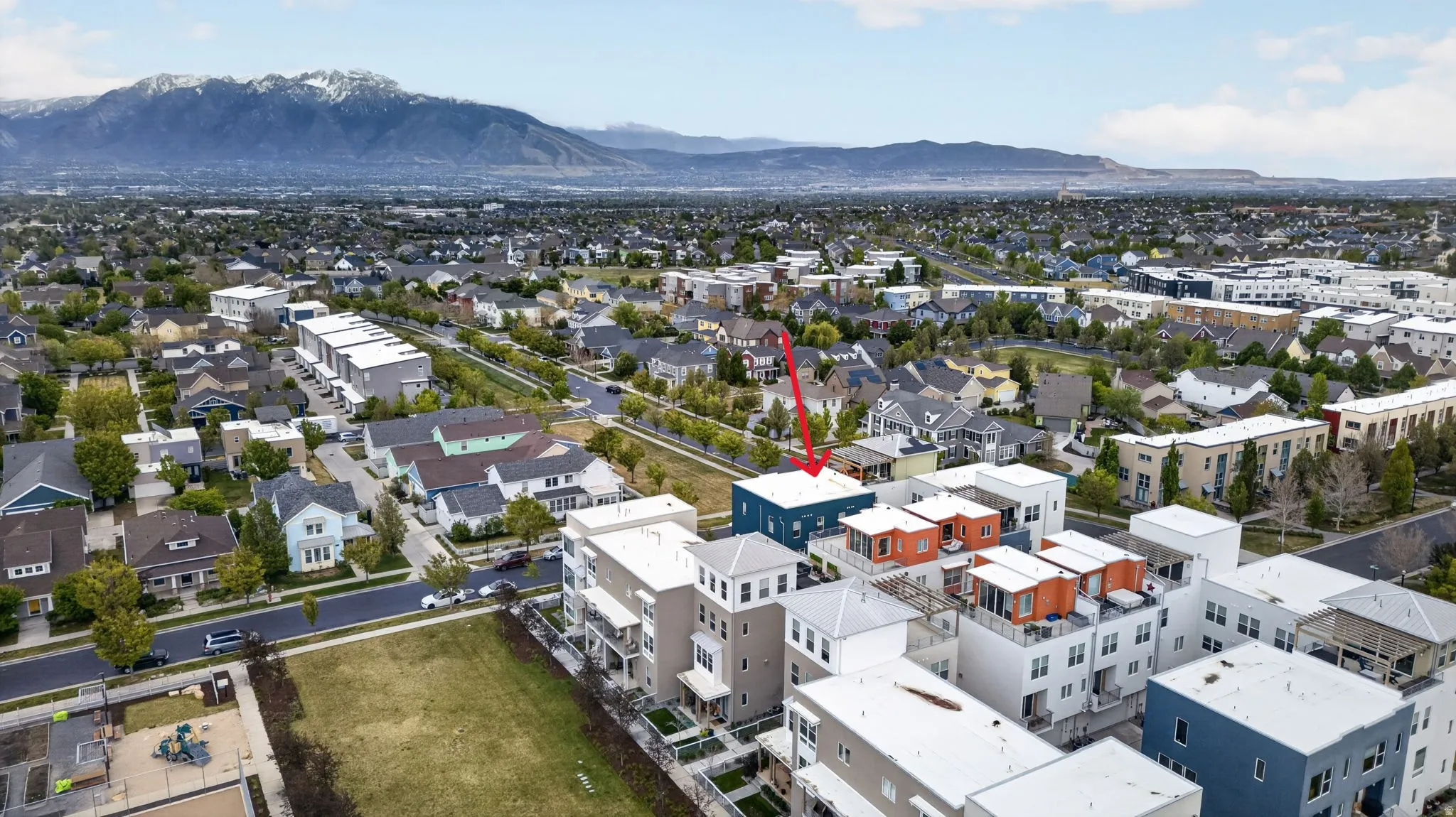 Aerial perspective showcasing a contemporary multi-story building with a flat roofline